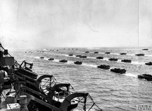 A fleet of Landing Craft Assaul (LCA) passing a landing ship during exercises prior to the invasion of Normandy.