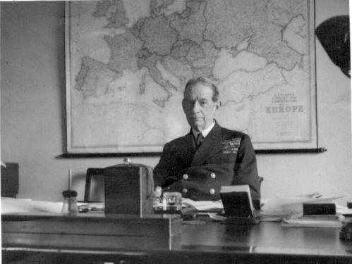 Sir Roger Keyes, the first Director of the Combined Operations Command at his desk in COHQ.