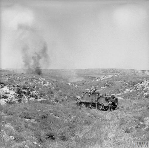 August 1943: A British self propelled 'Priest' gun in action against the town of Palazzolo.